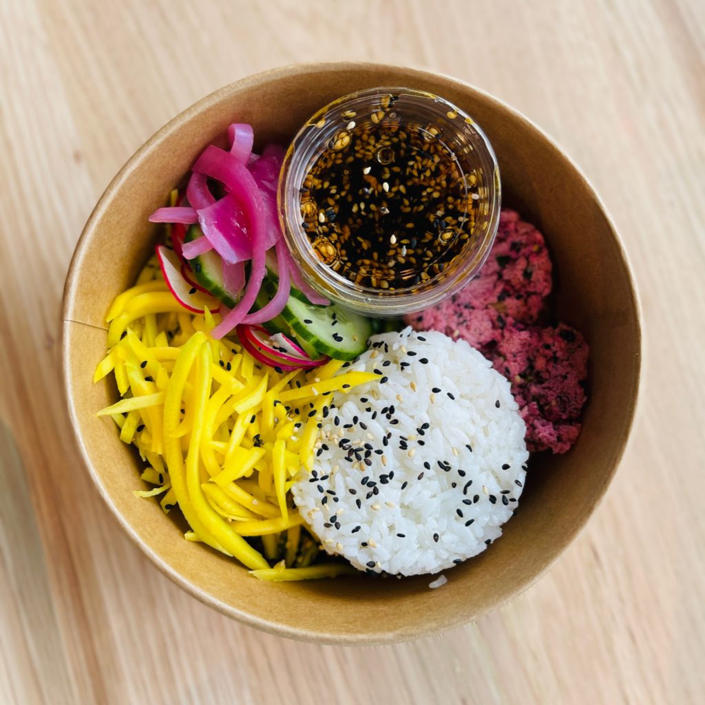 Plant Based and Delicious Sushi Bowl with No Tuna Protein Mix Shredded Mango and Seasoned Sushi Rice with Garlic Aioli and Sesame Soy Sauce from Menu Mandala who makes the best food in Calgary